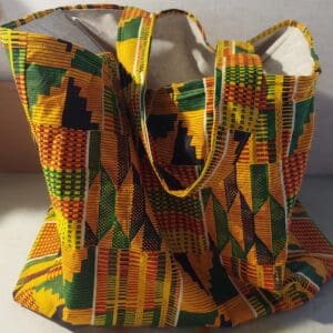 Colorful woven bag with traditional African patterns.