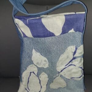 A blue and white fabric bag with leaf patterns.