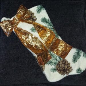 Handmade Christmas stocking decorated with pinecones and gold accents.