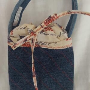 Small denim handbag with patterned fabric drawstring