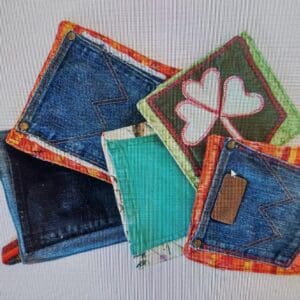 Assorted colorful fabric coasters with denim pockets