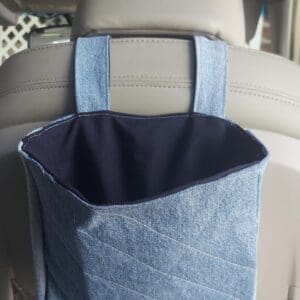 Denim hanging storage pouch on car seat