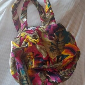 Bright floral fabric handbag with braided handles
